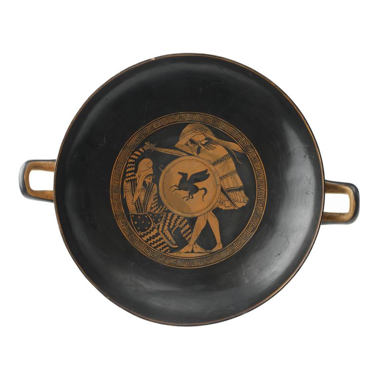 The inside of a wide, shallow bowl seen from above. There are two small handles on either side.